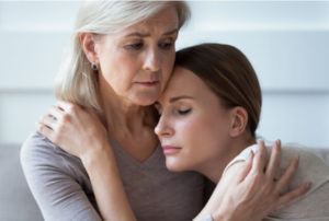 a mother consoling her daughter after a wrongful death in Georgia