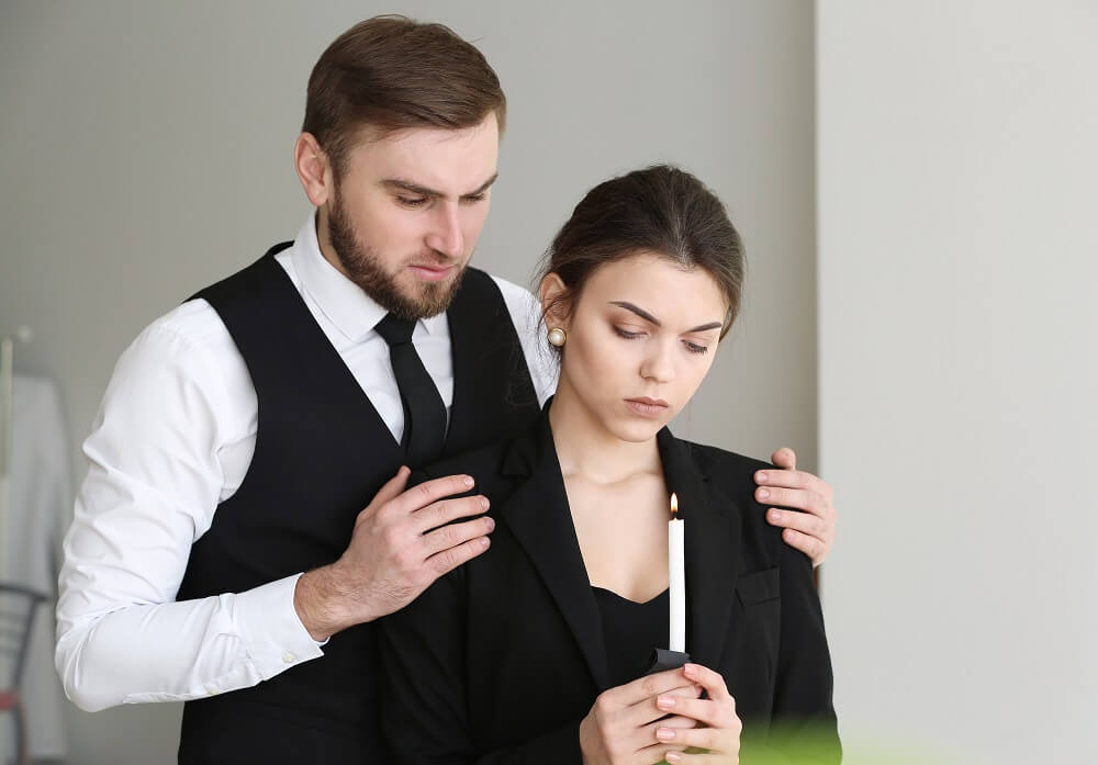 Sad couple grieving over loss of love ones.