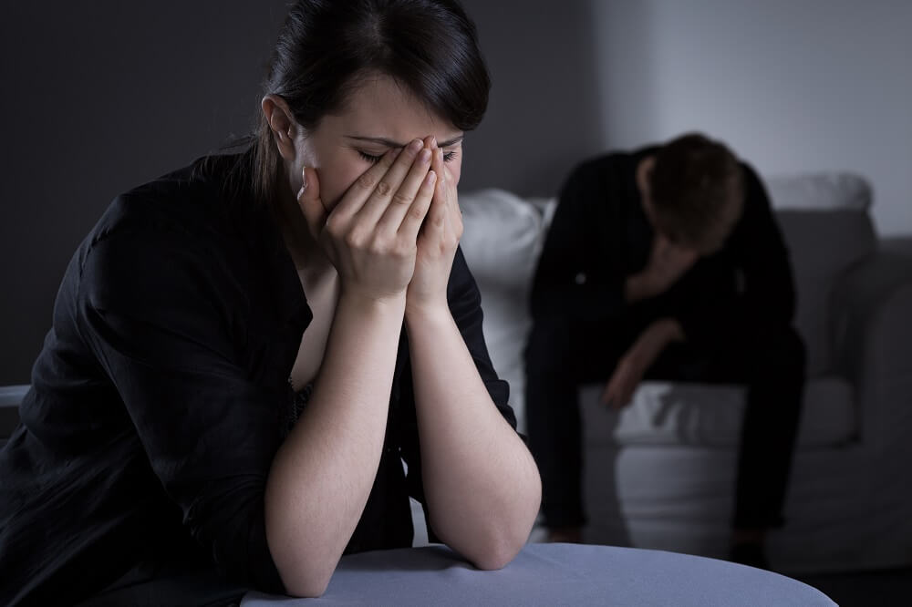 Couple grieving over loss of parents