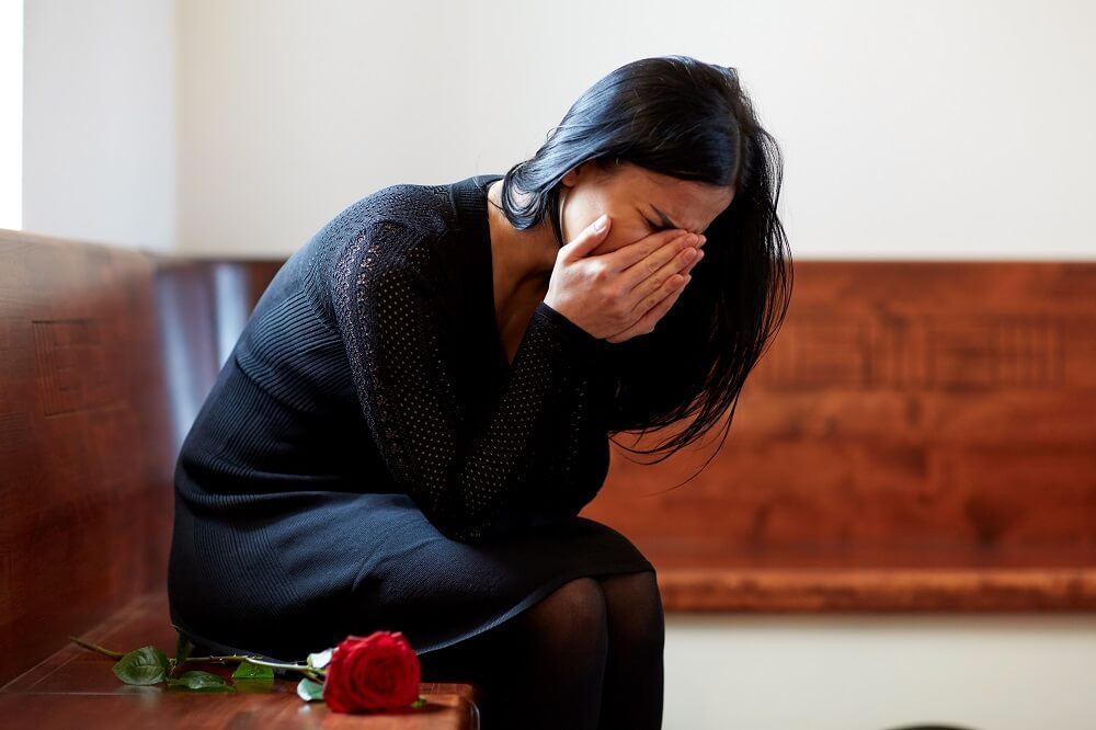 Devastated woman after wrongful death of husband.