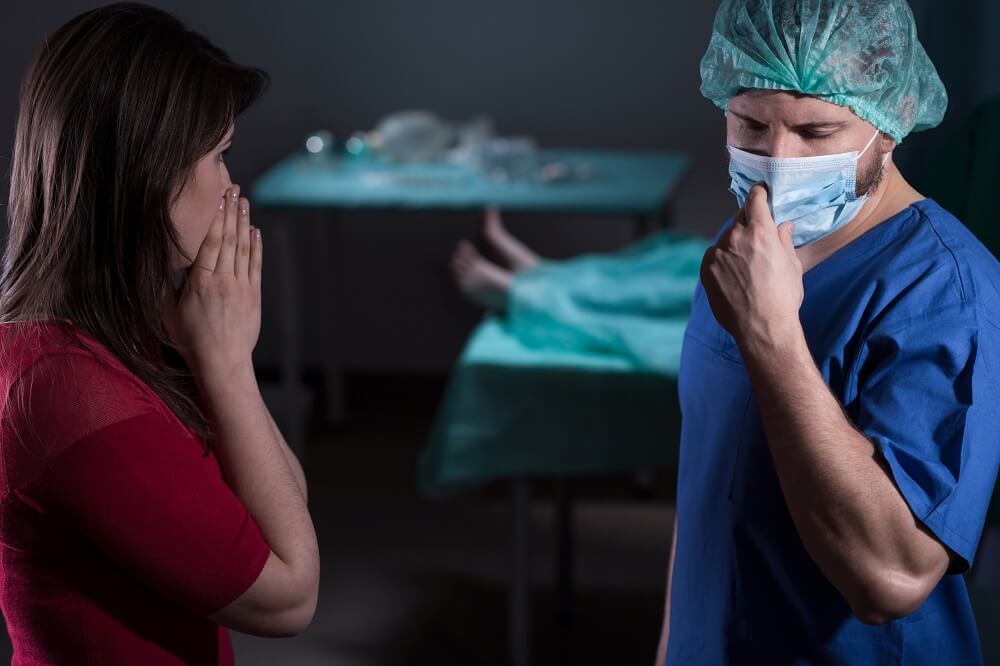 Sad wife on the passing of her husband due to medical errors.